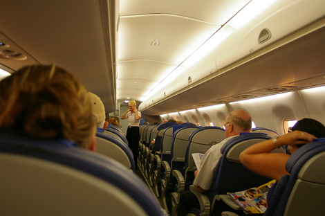Where you sit on a plane determines how often you get up and move around, new research suggests.